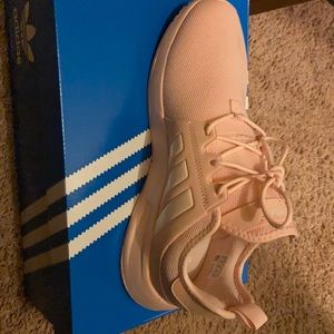 I am selling never worn pink Adidas.